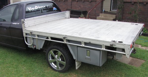 Products on this flat top, 30 litre water tank with stainless steel straps, Mudguards and Ute Tool Boxes